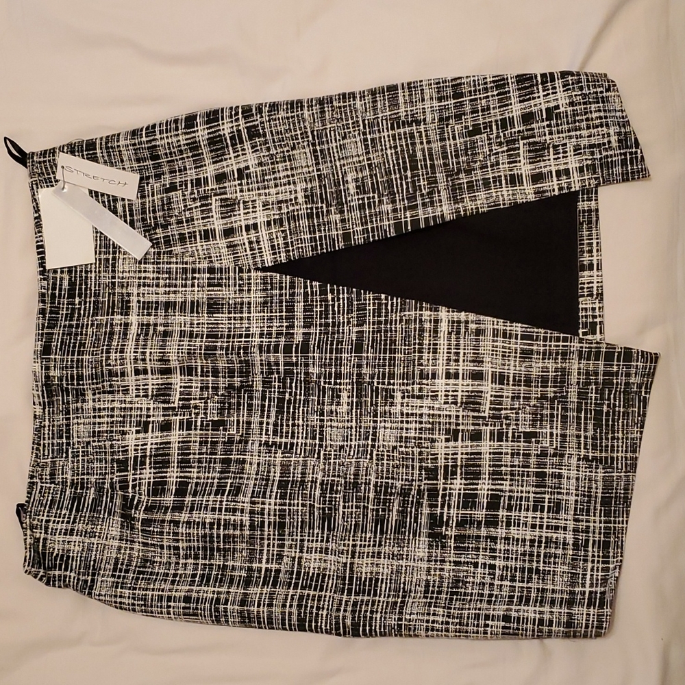 Cute Black and cream patterned skirt with flap design.